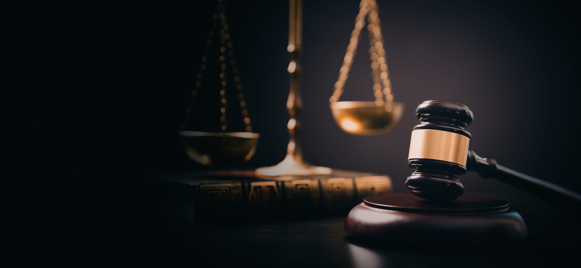 Wooden gavel and weight scale on table